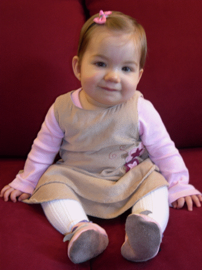 Lily on a RED couch